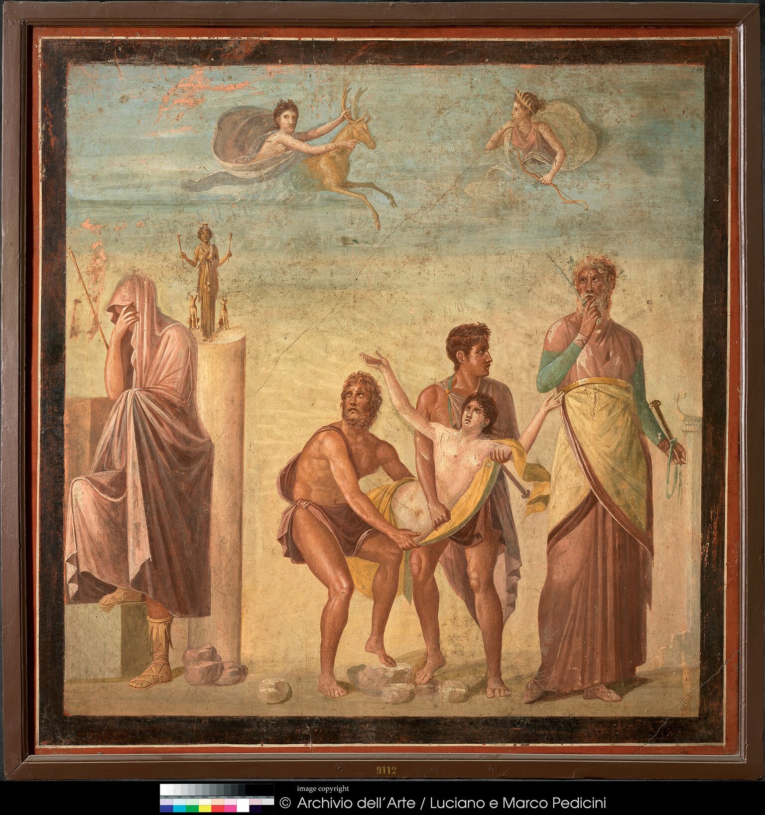 Λεζάντα:  Τοιχογραφία με σκηνή από τη θυσία της Ιφιγένειας 62–79 μ.Χ. Πομπηία, Οικία του Τραγικού Ποιητή  Νάπολη, Museo Archeologico Nazionale 